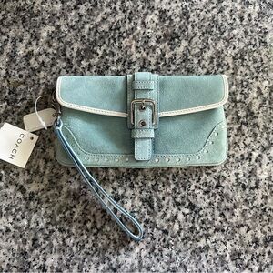 Blue suede Coach wristlet with white leather trim.